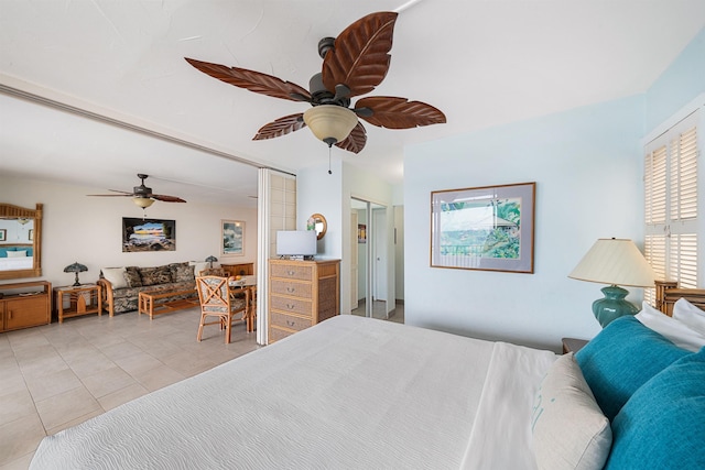 bedroom with ceiling fan, light tile patterned flooring, and french doors