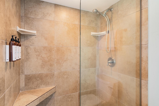 bathroom with a tile shower