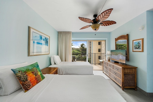 tiled bedroom with access to outside and ceiling fan