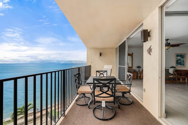 balcony featuring a water view