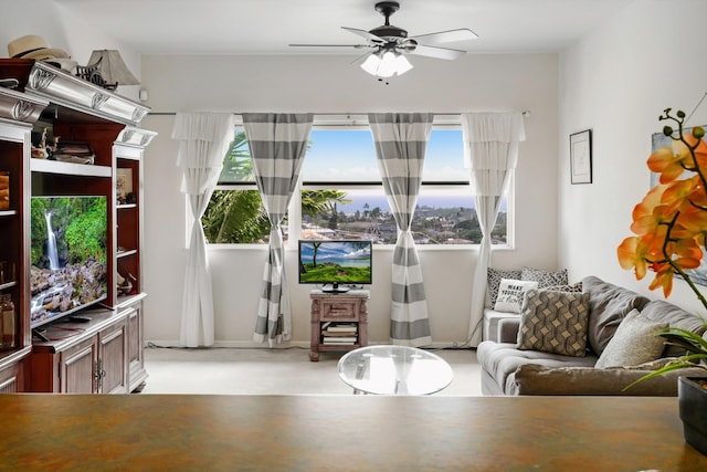 living area with ceiling fan