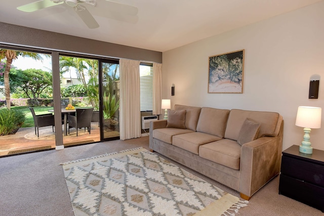 living room with ceiling fan, light carpet, and a wall mounted air conditioner