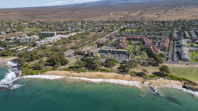 birds eye view of property featuring a view of the beach and a water view