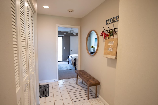 corridor featuring light tile patterned flooring