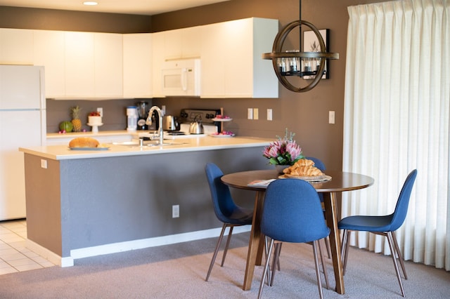 kitchen featuring white cabinetry, white appliances, sink, and light tile patterned floors