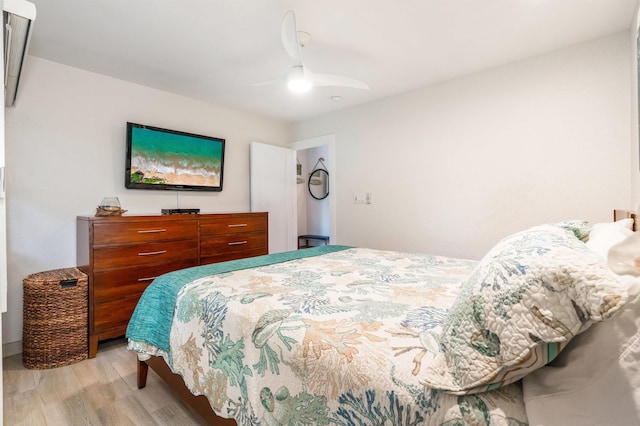 1299 Uluniu Rd Unit 106C, Kihei, HI 96753 - bedroom featuring light wood-style flooring and a ceiling fan