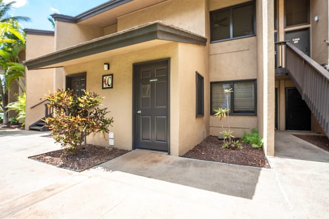 1299 Uluniu Rd Unit 106C, Kihei, HI 96753 - property entrance with stucco siding