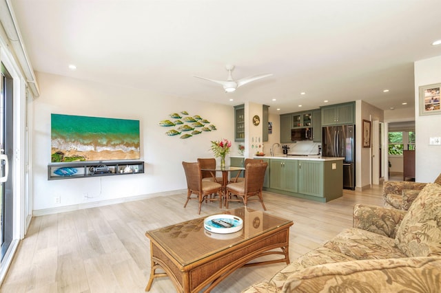 1299 Uluniu Rd Unit 106C, Kihei, HI 96753 - living room featuring light wood-type flooring, a ceiling fan, and recessed lighting