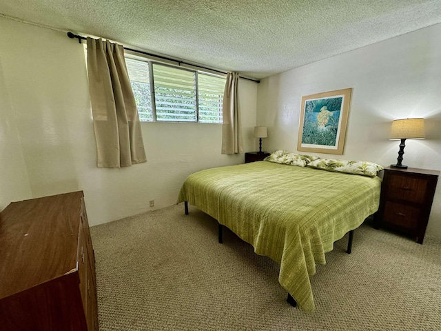 7146 Kamehameha V Hwy Unit C107, Kaunakakai, HI 96748 - bedroom with a textured ceiling and carpet floors