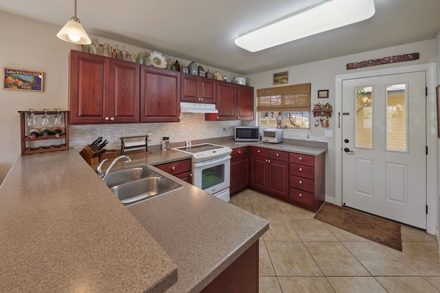 62 Meheu Cir, Kahului, HI 96732 - kitchen with stainless steel microwave, under cabinet range hood, white electric range, a sink, and reddish brown cabinets