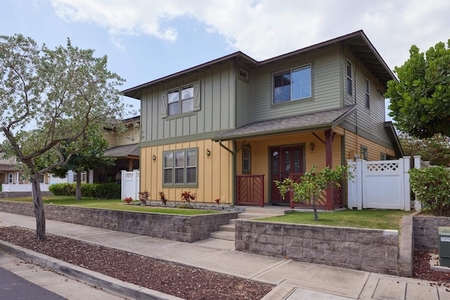 62 Meheu Cir, Kahului, HI 96732 - view of front facade with board and batten siding, fence, and a gate
