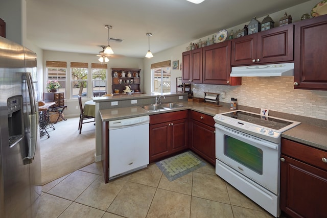 62 Meheu Cir, Kahului, HI 96732 - kitchen featuring tasteful backsplash, a sink, white appliances, a peninsula, and under cabinet range hood
