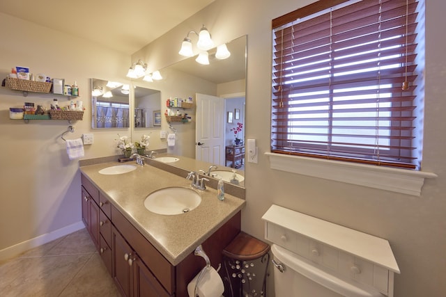 62 Meheu Cir, Kahului, HI 96732 - bathroom with a sink, tile patterned floors, double vanity, and baseboards