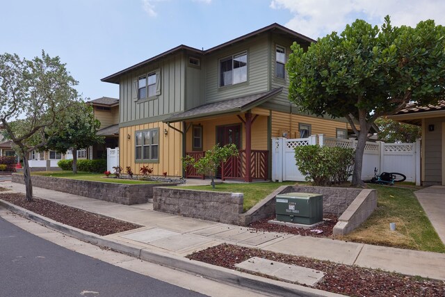 62 Meheu Cir, Kahului, HI 96732 - view of front facade featuring board and batten siding, fence, and a gate