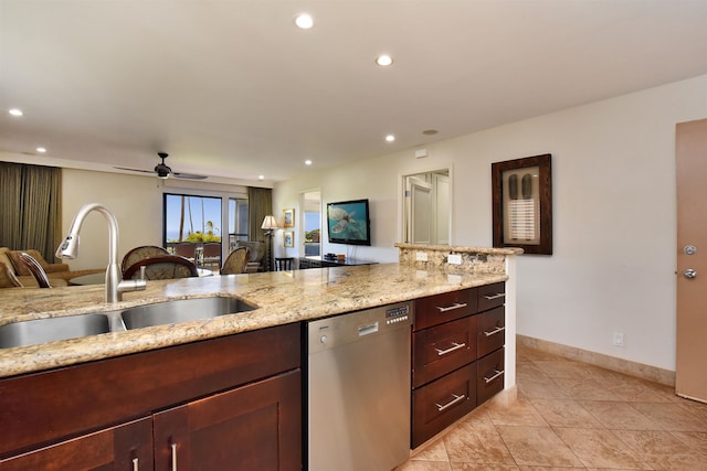 kitchen featuring light tile patterned floors, light stone countertops, ceiling fan, sink, and stainless steel dishwasher