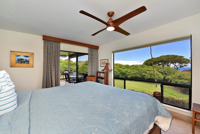 bedroom featuring tile patterned floors and ceiling fan