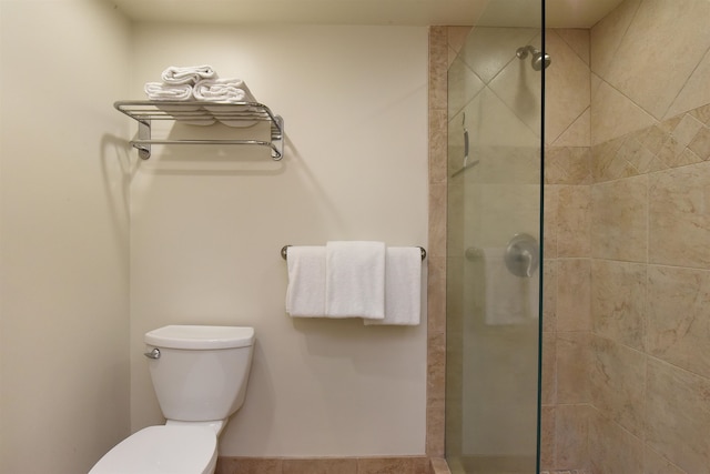 bathroom with walk in shower and toilet