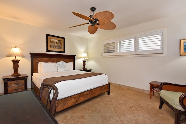 bedroom with ceiling fan and light tile patterned flooring