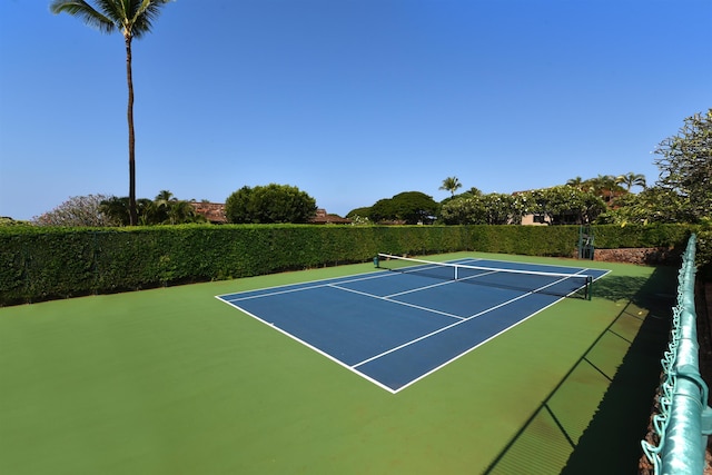 view of sport court with fence