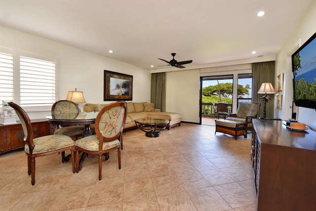 living room featuring ceiling fan and light tile patterned flooring