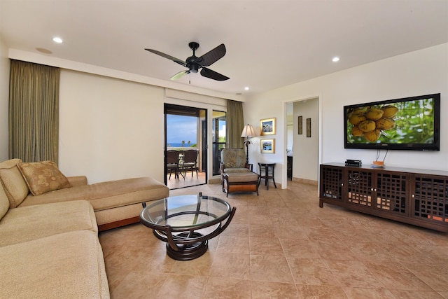 living room with ceiling fan and light tile patterned floors