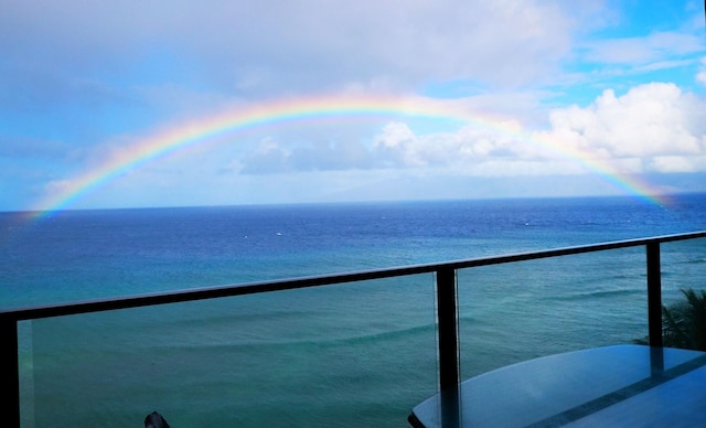 balcony featuring a water view