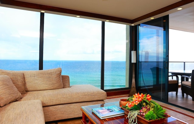 sunroom / solarium with a water view and a wealth of natural light