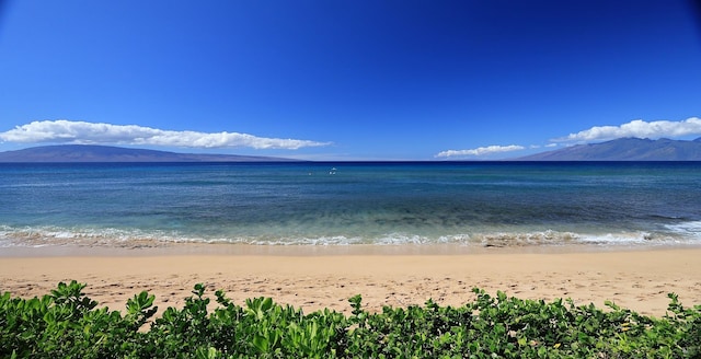 property view of water featuring a view of the beach and a mountain view