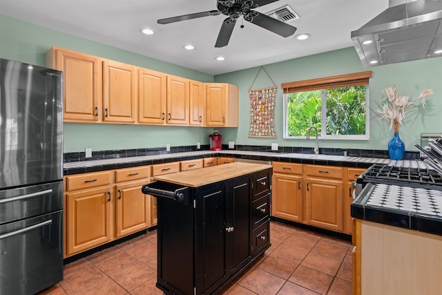 473 Kalalau Pl, Kihei, HI 96753 - kitchen with freestanding refrigerator, extractor fan, a sink, recessed lighting, and tile patterned flooring