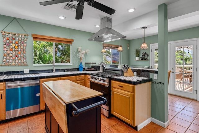473 Kalalau Pl, Kihei, HI 96753 - kitchen featuring dishwasher, island range hood, gas stove, a sink, and plenty of natural light