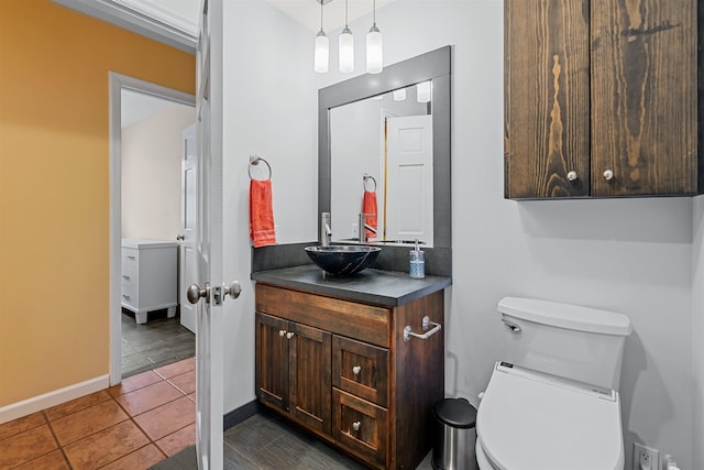 473 Kalalau Pl, Kihei, HI 96753 - bathroom with vanity, tile patterned floors, baseboards, and toilet