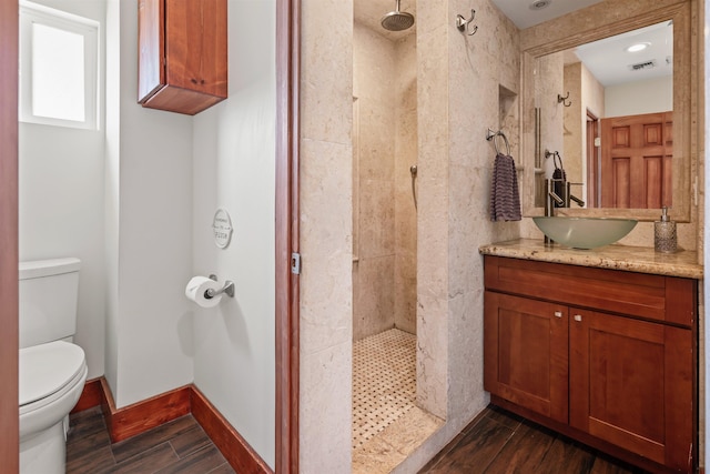 473 Kalalau Pl, Kihei, HI 96753 - full bath featuring toilet, vanity, tiled shower, and wood finished floors