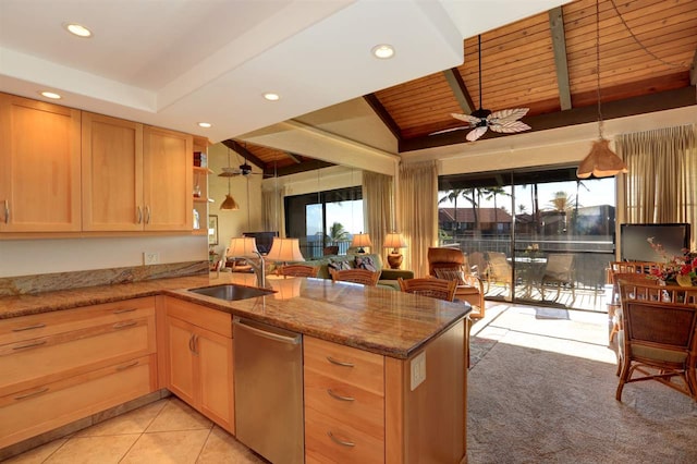 kitchen with kitchen peninsula, ceiling fan, sink, and stainless steel dishwasher