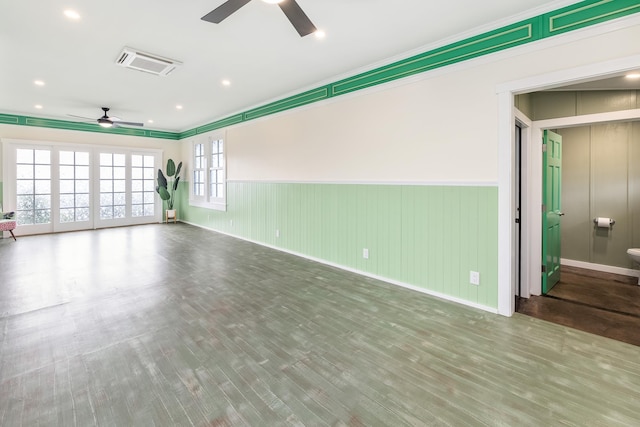 empty room with ceiling fan and wood-type flooring