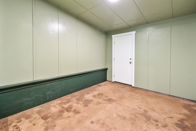 basement featuring light colored carpet