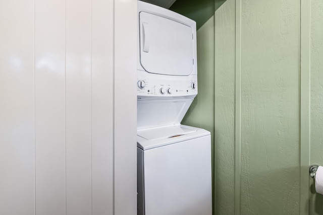 laundry area featuring stacked washer and dryer