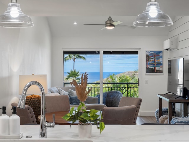 3950 Kalai Waa St Unit C202, Kihei, HI 96753 - living area featuring a ceiling fan, wood finished floors, an AC wall unit, and recessed lighting