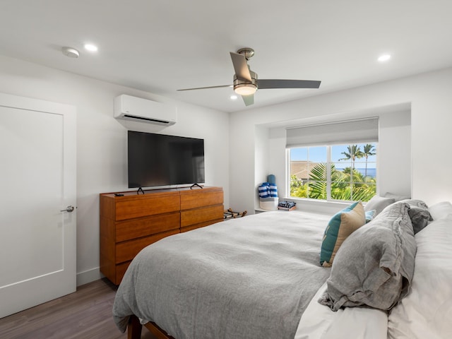 3950 Kalai Waa St Unit C202, Kihei, HI 96753 - bedroom featuring a wall unit AC, wood finished floors, recessed lighting, and ceiling fan