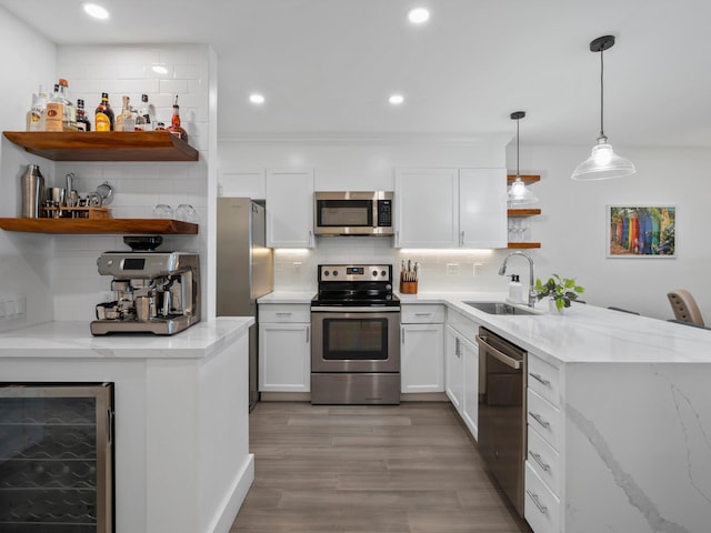 3950 Kalai Waa St Unit C202, Kihei, HI 96753 - kitchen featuring open shelves, appliances with stainless steel finishes, wine cooler, tasteful backsplash, and white cabinets