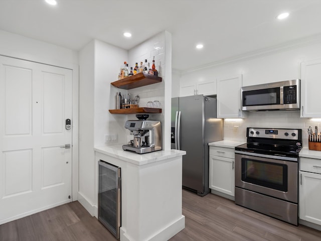 3950 Kalai Waa St Unit C202, Kihei, HI 96753 - kitchen with appliances with stainless steel finishes, wine cooler, open shelves, tasteful backsplash, and wood finished floors
