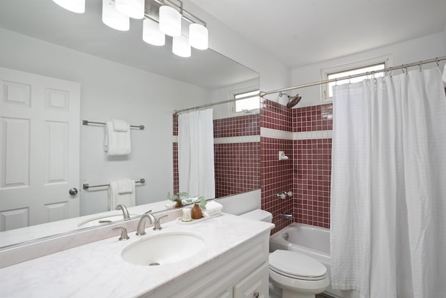 full bath featuring vanity, toilet, and shower / tub combo with curtain