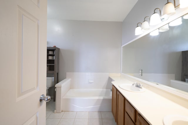 bathroom featuring vanity, tile patterned floors, a bathtub, and toilet