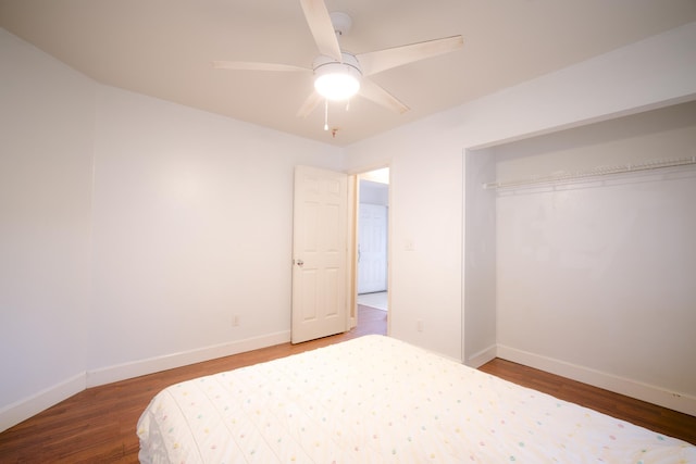 bedroom featuring wood-type flooring, a closet, and ceiling fan