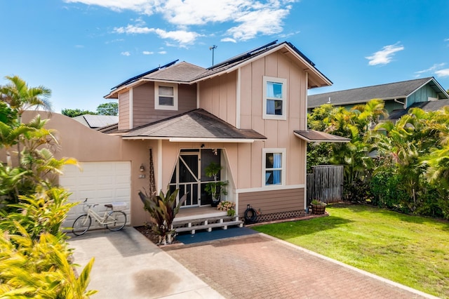 19 Hoku Pl, Paia, HI 96779 - traditional-style house featuring board and batten siding, a shingled roof, roof mounted solar panels, and a garage