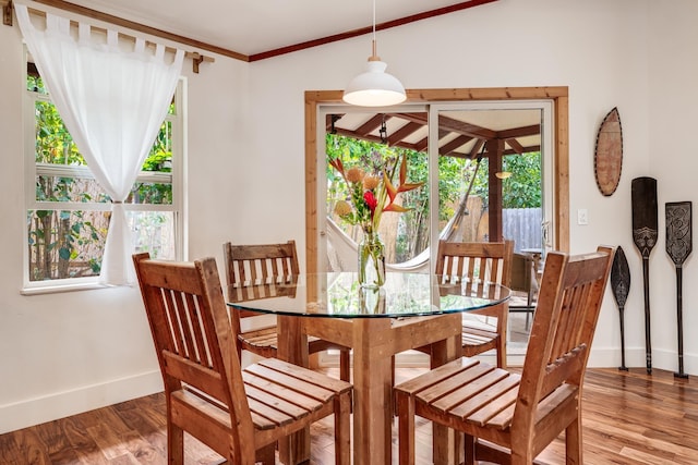 19 Hoku Pl, Paia, HI 96779 - dining space with baseboards, wood finished floors, and ornamental molding