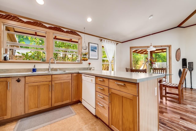 19 Hoku Pl, Paia, HI 96779 - kitchen with dishwasher, a sink, a peninsula, ornamental molding, and light countertops