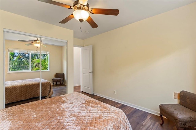 bedroom with ceiling fan, dark hardwood / wood-style flooring, and a closet