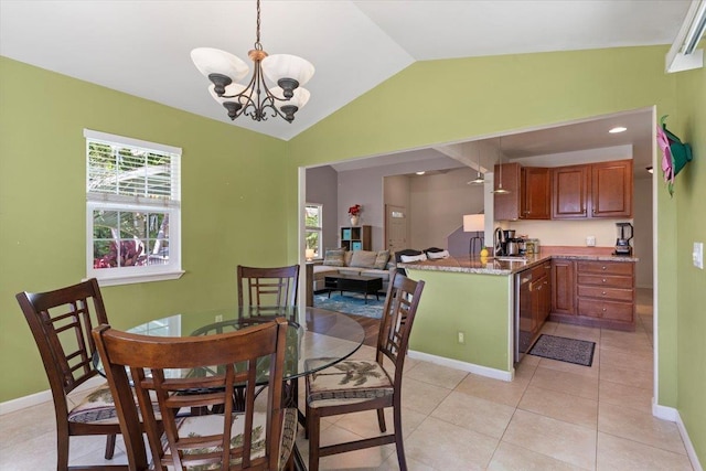 dining room featuring light tile patterned floors, vaulted ceiling, and an inviting chandelier