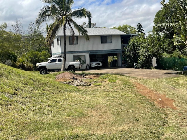 271 Makaena Pl, Pukalani, HI 96768 - view of side of property featuring a carport, driveway, and a lawn
