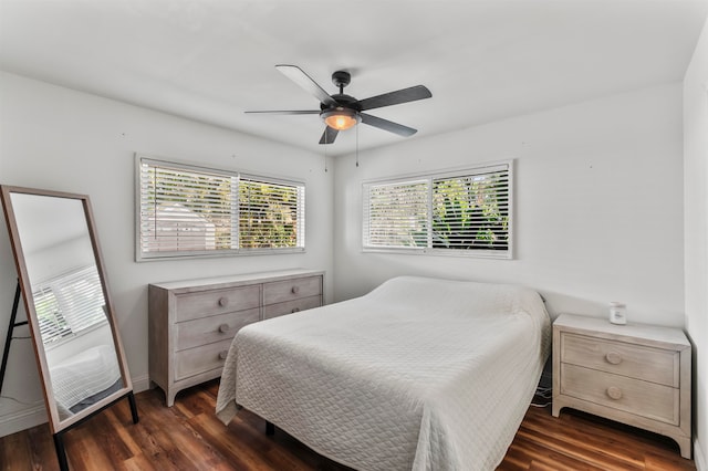 bedroom with dark wood-type flooring and ceiling fan